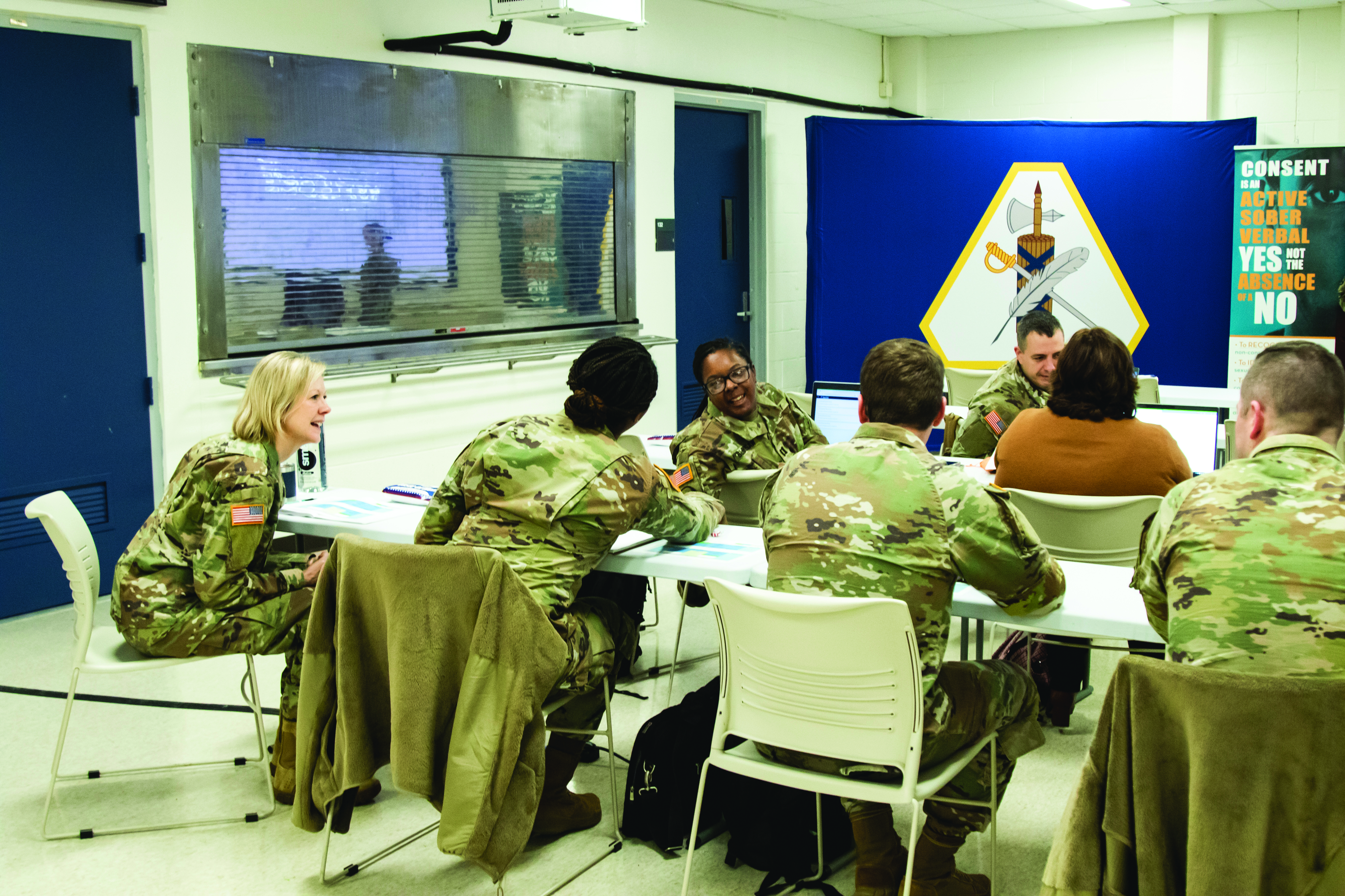 Active and Reserve component attendees discuss their unique experiences during the integrated SVC Regional Training held 5-7 December 2023 at the USARLC in Gaithersburg, MD. In this photograph, MAJ Amanda M. Baylor, USAR SVC deputy program manager (left), enjoys a light-hearted exchange between MAJ Daphne A. Trombley, USAR SVC Southwest regional manager (1st LOD) (middle) and CPT Gabrielle D. Bloodsaw, Army SVC (Maneuver Center of Excellence, Fort Moore) (front-right). (Credit: 1LT Amber Lamb, USARLC)